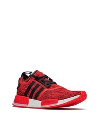 rote und schwarze Sportschuhe von adidas