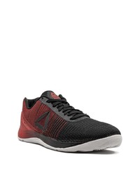 rote und schwarze Sportschuhe von Reebok