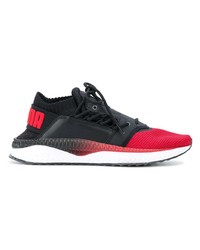 rote und schwarze Sportschuhe von Puma