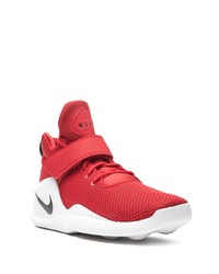 rote und weiße Sportschuhe von Nike