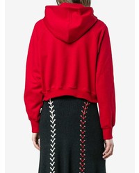 roter Pullover mit einer Kapuze von Esteban Cortazar