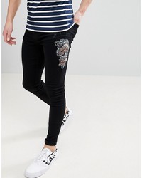 schwarze bedruckte enge Jeans von Brooklyn Supply Co.