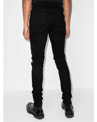 schwarze bedruckte enge Jeans von Amiri