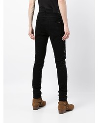 schwarze bedruckte enge Jeans von Amiri