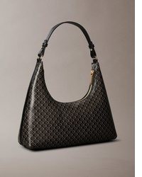 schwarze bedruckte Taschen von Calvin Klein