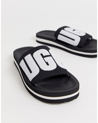 schwarze bestickte flache Sandalen aus Segeltuch von UGG