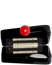 schwarze Clutch von Charlotte Olympia