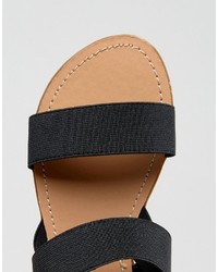 schwarze elastische flache Sandalen von London Rebel