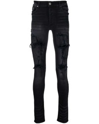 schwarze enge Jeans mit Destroyed-Effekten von Amiri