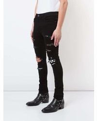 schwarze enge Jeans mit Destroyed-Effekten von Amiri