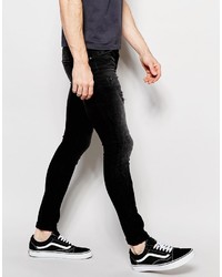 schwarze enge Jeans mit Destroyed-Effekten von Asos