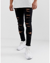 schwarze enge Jeans mit Destroyed-Effekten von ASOS DESIGN