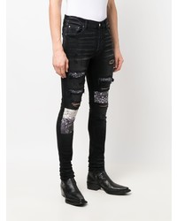 schwarze enge Jeans mit Destroyed-Effekten von Amiri