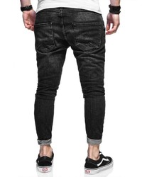 schwarze enge Jeans mit Destroyed-Effekten von behype