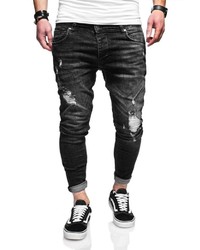 schwarze enge Jeans mit Destroyed-Effekten von behype