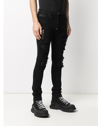 schwarze enge Jeans mit Destroyed-Effekten von Philipp Plein