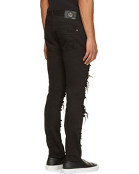 schwarze enge Jeans mit Destroyed-Effekten von Versace