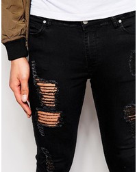 schwarze enge Jeans mit Destroyed-Effekten von Asos