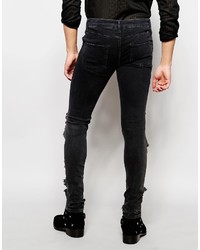 schwarze enge Jeans mit Destroyed-Effekten von Asos