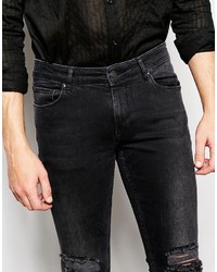 schwarze enge Jeans mit Destroyed-Effekten von Asos