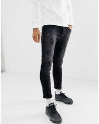 schwarze enge Jeans mit Destroyed-Effekten von Chasin'