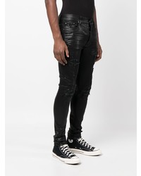 schwarze enge Jeans mit Destroyed-Effekten von Amiri