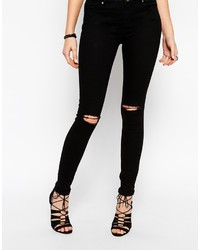 schwarze enge Jeans mit Destroyed-Effekten von Asos