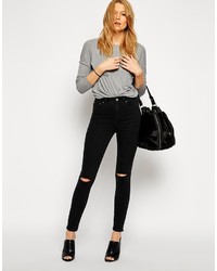 schwarze enge Jeans mit Destroyed-Effekten von Asos