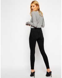 schwarze enge Jeans mit Destroyed-Effekten von Asos