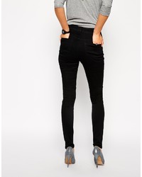 schwarze enge Jeans mit Destroyed-Effekten von Asos