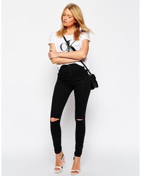 schwarze enge Jeans mit Destroyed-Effekten von Asos