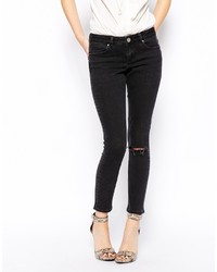 schwarze enge Jeans mit Destroyed-Effekten von Asos