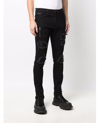 schwarze enge Jeans mit Destroyed-Effekten von Philipp Plein