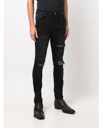 schwarze enge Jeans mit Destroyed-Effekten von Amiri