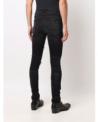 schwarze enge Jeans mit Destroyed-Effekten von Amiri