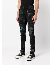 schwarze enge Jeans mit Destroyed-Effekten von Amiri