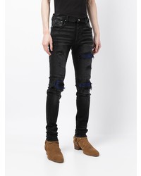 schwarze enge Jeans mit Destroyed-Effekten von Amiri