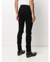 schwarze enge Jeans mit Destroyed-Effekten von Amiri