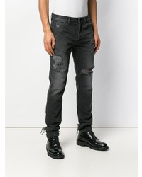 schwarze enge Jeans mit Destroyed-Effekten von Marcelo Burlon County of Milan