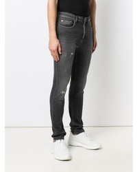 schwarze enge Jeans mit Destroyed-Effekten von Neil Barrett