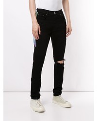 schwarze enge Jeans mit Destroyed-Effekten von Amiri