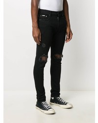 schwarze enge Jeans mit Destroyed-Effekten von Represent