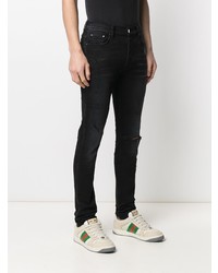 schwarze enge Jeans mit Destroyed-Effekten von Amiri