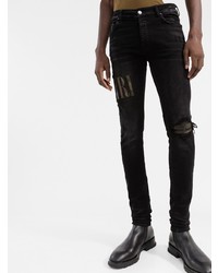 schwarze enge Jeans mit Destroyed-Effekten von Amiri