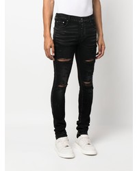 schwarze enge Jeans mit Destroyed-Effekten von Amiri