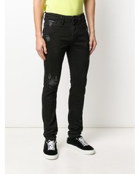 schwarze enge Jeans mit Destroyed-Effekten von Philipp Plein