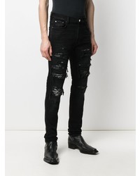 schwarze enge Jeans mit Destroyed-Effekten von Amiri