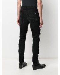 schwarze enge Jeans mit Destroyed-Effekten von Amiri