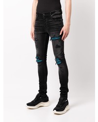 schwarze enge Jeans mit Destroyed-Effekten von Amiri