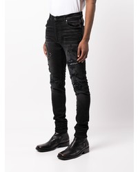 schwarze enge Jeans mit Destroyed-Effekten von Amiri